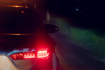 Blurred image of cars on the road with light break at in evening.