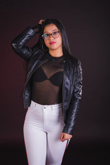 Young girl model posing in black background studio with black transparency t-shirt