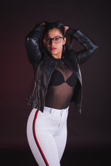 Young girl model posing in black background studio with black transparency t-shirt