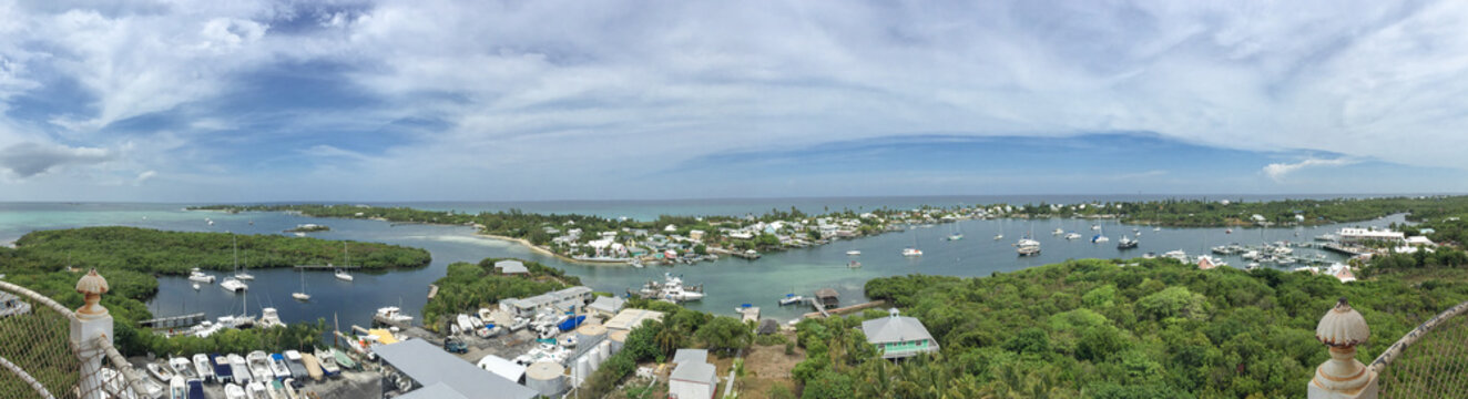 Panoramic image of Hope Town, Abaco, Bahamas with boats and water; landscape