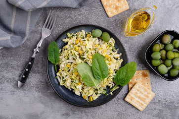 Vegetable salad with olives and spinach