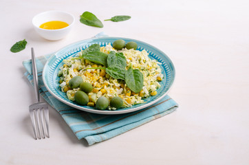 Vegetable salad with olives and spinach