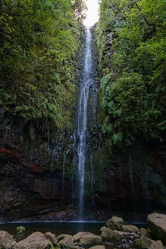 Beautiful waterfall at the end of a levada hike, trekking path, background picture