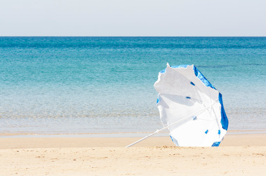Beach umbrella blown away by the wind
