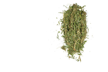 Loose dried marijuana cannabis pot weed grass stems in a pile isolated on white