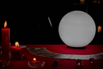 Fortune Teller young Asian woman Gypsy glowing crystal ball, tarot cards, magic, and composition...