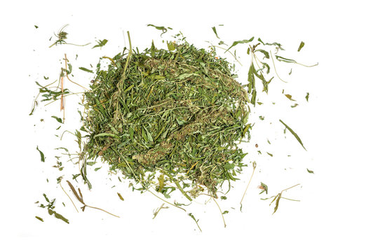 Loose dried marijuana cannabis pot weed grass stems in a pile  isolated on white