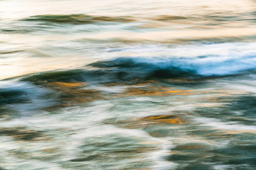 Water surface abstract background. Sunset over the sea