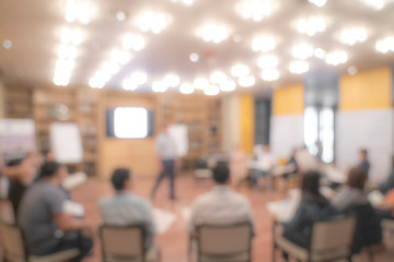 Blurry Asian people sit in round for meeting and share experience.