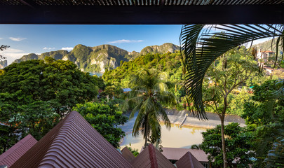 View of Phi Phi mountains landscape and sea along with the green palm trees from hotel room.