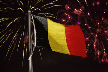 Belgium flag blowing in the wind at night