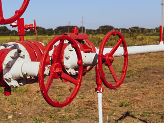 Manual shut-off valve on oil well. Oil well wellhead equipment.