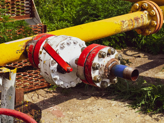 Manual shut-off valve on oil well. Oil well wellhead equipment.