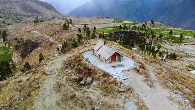 Aerial Circle Shot of Peruvian Small Church in Cabanaconde on top of Hill