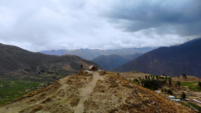 Forward aerial shot over Peruvian Church on top of Hill in Cabanaconde