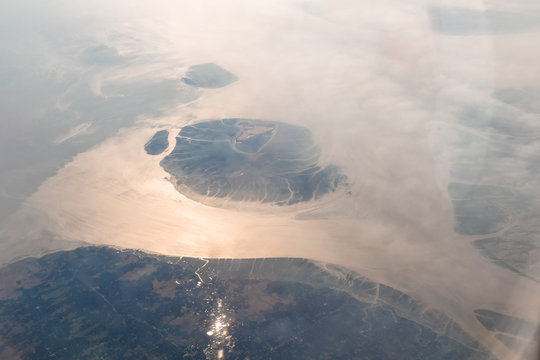Aerial View of the magnificent Bramhaputra River in Bangladesh from the airplane. selective focus.