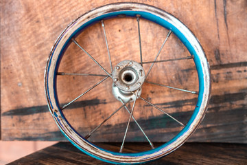 Abandoned and damaged Black and alloy bicycle wheel isolated on white background