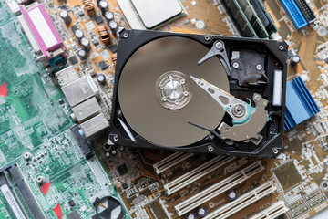Obraz premium the macro view of thye hdd drive with information data, magnetic disc, electronic board background