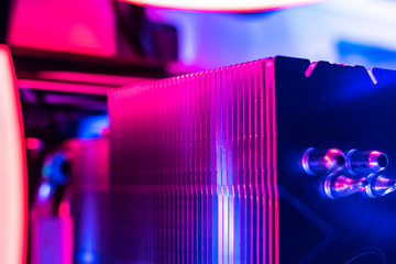 macro view of the computer radiator to deal with the heat, abstract view with rgb color light