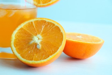 Orange fresh drink, glass of orange juice and ripe citrus fruits on white background