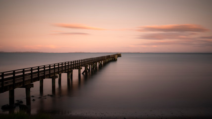 Long exposure image of Cornwallis Wharf in Auckland at sunset