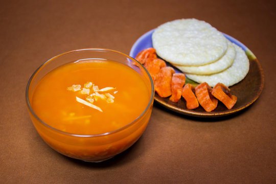 Sikhye, dried persimmon and rice crackers. "Sikhye" is a traditional Korean beverage made with rice and other ingredients. "Andong-Sikhye" is a local cuisine in Andong, Gyeongsangbuk-do, Korea.