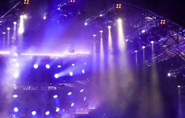 Purple light on a rock concert stage as background