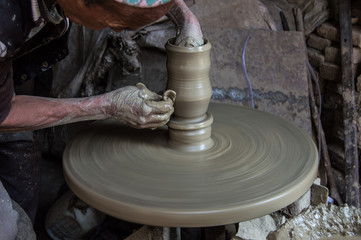 An old man designing a clay pot on Durbar square in Bhaktapur, Nepal