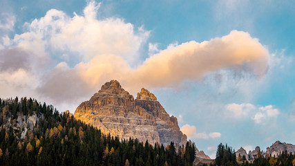 View behind Tre cime and nature landscape from Dolomites after sunset during autumn season...
