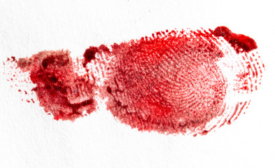 Fingerprint of red paint on a white paper