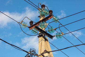 Electric pole against the blue sky