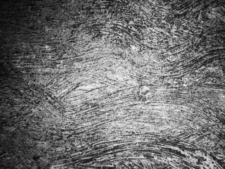 Abstract scratch grunge concrete wall texture. Use as a background or wallpaper. Space for text. Black and white, so contrast and grainy