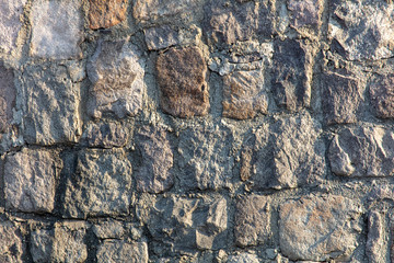 Fototapeta premium Wall of stone blocks as an abstract background