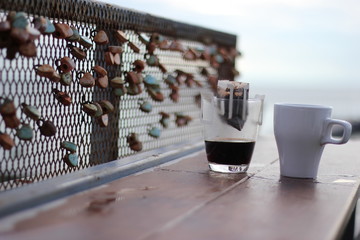 coffee in the morning, cup of cappuccino on wood table in cafe or coffeeshop.