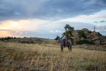Cow Girl On Rocky Mountain Horse