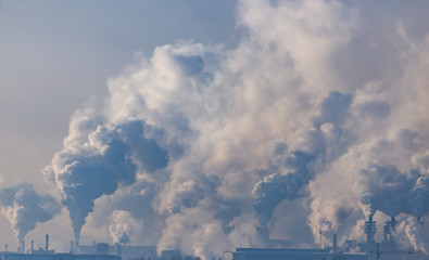 Smoke from the chimneys of a metallurgical plant at dawn