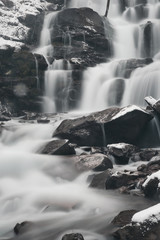 winter mountains waterfall. water motion blurred