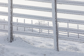 Wooden fences that delimit access to the track of the Navacerrada ski resort in Madrid