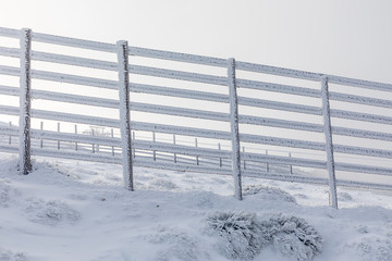 Wooden fences that delimit access to the track of the Navacerrada ski resort in Madrid