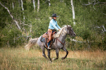 Cowgirl On Rocky Mountain Horse