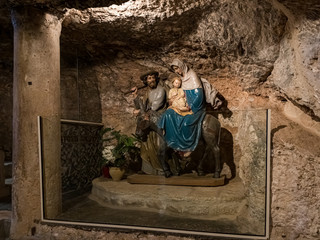 Figures depicting a scene from the Bible stand in a niche in the Milk Grotto Church in Bethlehem in Palestine