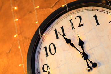 Fototapeta na wymiar Countdown to midnight. Retro style clock counting last moments before Christmas or New Year - Image