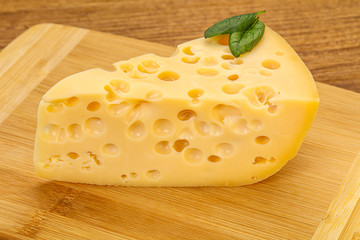 Maasdam cheese - yellow triangle with holes