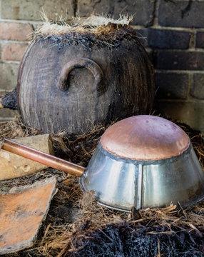 A copper bottom pot is used for condensation in the distillation of mezcal in Mexico.