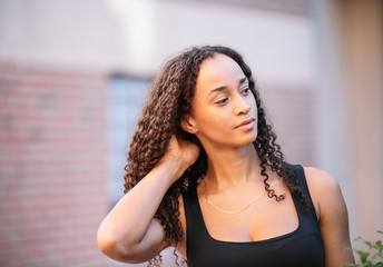 Naklejka premium photo of a black girl with long hair posing and wearing sports clothes. Fitness