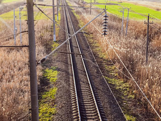 Fototapeta na wymiar Plot railway. Top view on the rails. High-voltage power lines for electric trains