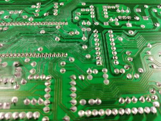 beautiful industrial surface background of an old soldered circuit board