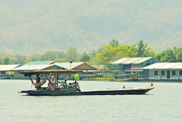 Tanker or ferry car croos a river