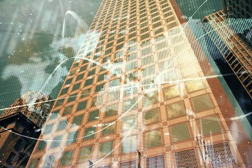 Forex chart on cityscape with tall buildings background multi exposure. Financial research concept.