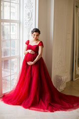 Pregnant woman at red dress